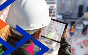 Construction worker reviewing productivity data on tablet