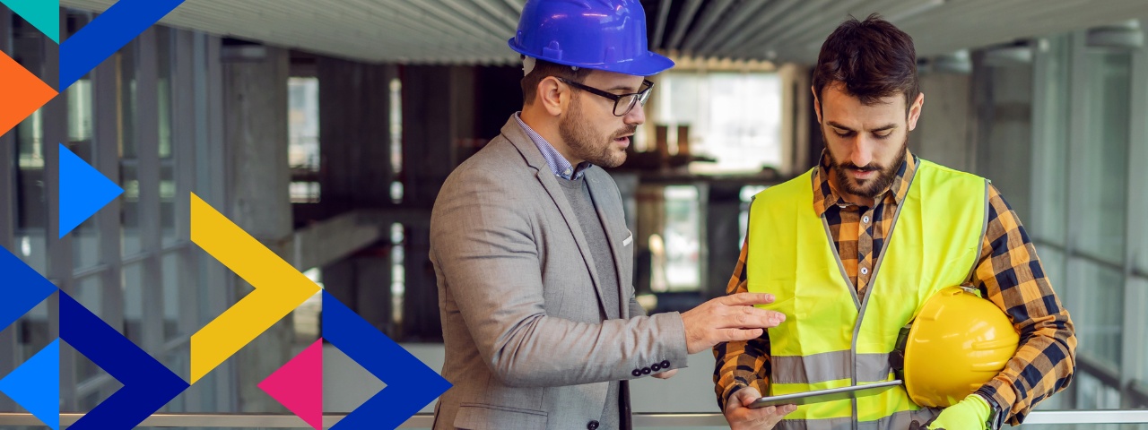 Project manager and builder reviewing issue on tablet
